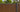 Weathered Teak with black gap wood composite fence kit with horizontal slats